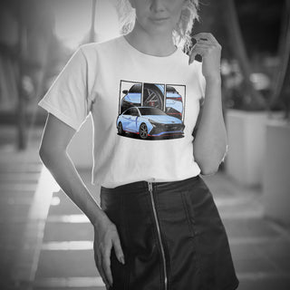Female model wearing Performance Sedan Legends white t-shirt with detailed car graphics inspired by the Hyundai Elantra N