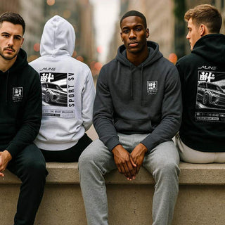 Group of four men wearing M Line Manga Series Vol. 01 hoodies in black, white and heather tones on a city ledge.