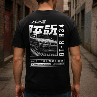 Lifestyle male rear, Black → Male model wearing VOL.02 The Legend Reborn Nissan GT-R R34 widebody manga t-shirt back print in white.