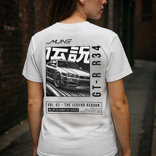 Lifestyle female rear, Black → Female model wearing VOL.02 The Legend Reborn Nissan GT-R R34 widebody manga t-shirt back print in black.