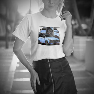 Female model wearing Performance Sedan Legends white t-shirt with detailed car graphics inspired by the Hyundai Elantra N