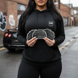 Close up shot of a woman holding three M Line Automotive silhouette air fresheners while wearing a black hoodie, premium street automotive aesthetic.
