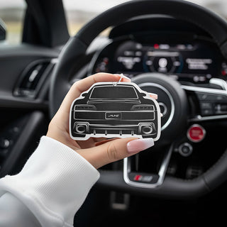 Hand holding |Audi R8 4S V10 silhouette air freshener with digital performance dashboard in background