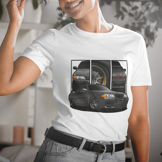 Female model wearing JDM Legends white t-shirt with detailed car graphics inspired by the NIssan GTR R32